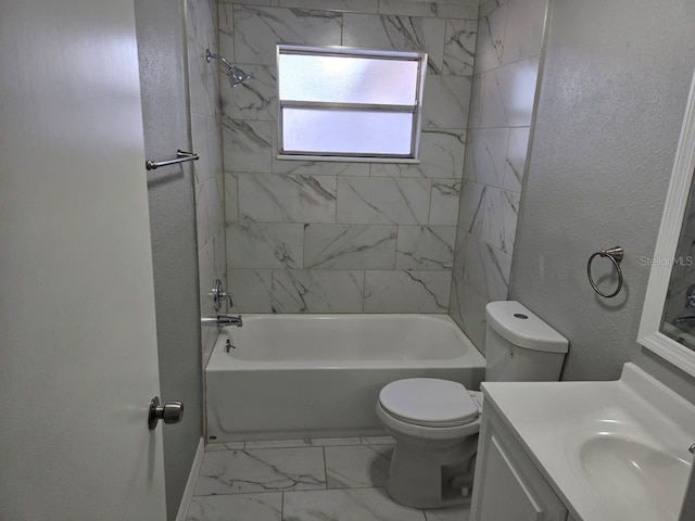 full bathroom with vanity, toilet, and tiled shower / bath combo