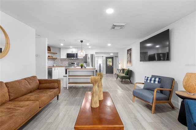 living room with light hardwood / wood-style floors