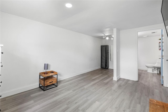 spare room with light wood-type flooring