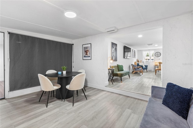 dining room with wood-type flooring