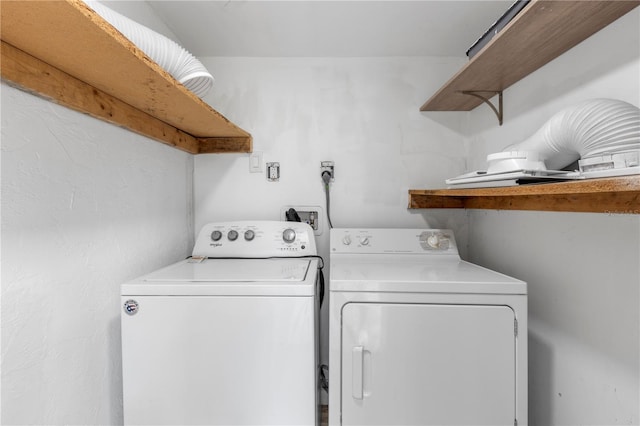 laundry room with washing machine and dryer