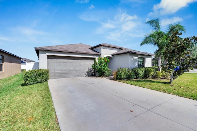 view of front of property featuring a garage and a front lawn