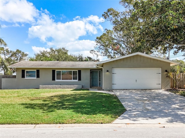 single story home featuring a front lawn and a garage