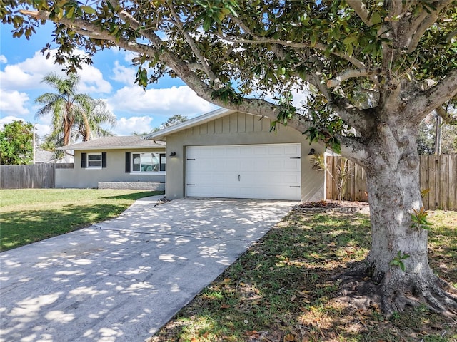 single story home with a front lawn and a garage