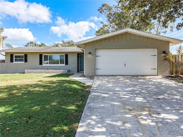 single story home featuring a front lawn and a garage