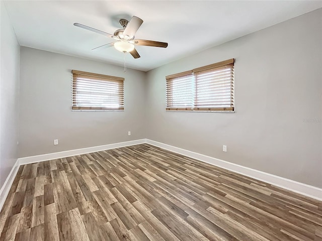 unfurnished room with hardwood / wood-style flooring, plenty of natural light, and ceiling fan