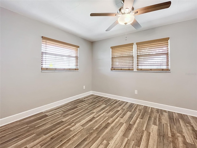 empty room featuring hardwood / wood-style flooring and ceiling fan