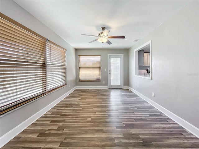 interior space featuring dark hardwood / wood-style floors and ceiling fan