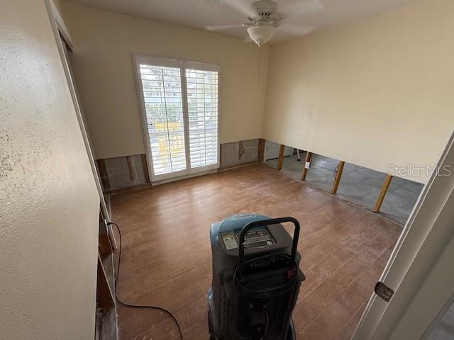 interior space featuring hardwood / wood-style floors and ceiling fan