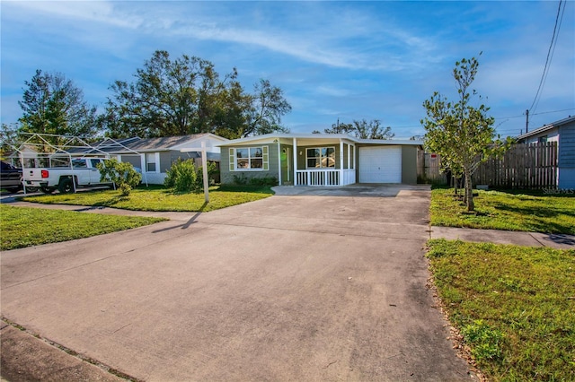 ranch-style house with a garage and a front lawn