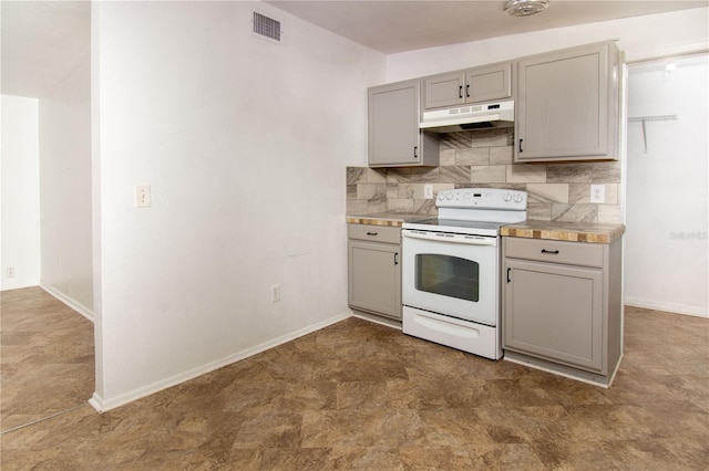 kitchen with gray cabinetry, tasteful backsplash, and white range with electric stovetop