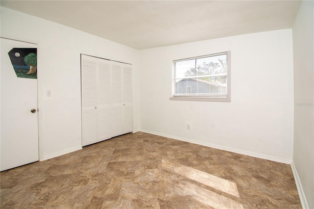 unfurnished bedroom featuring a closet