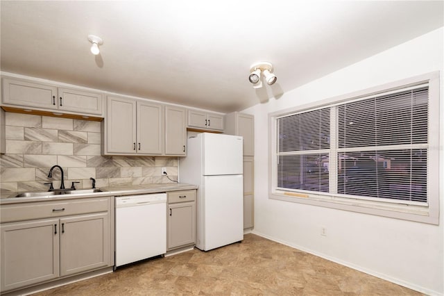 kitchen with sink, white appliances, and decorative backsplash