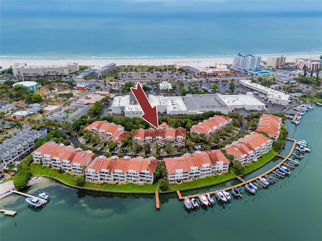 bird's eye view with a beach view and a water view