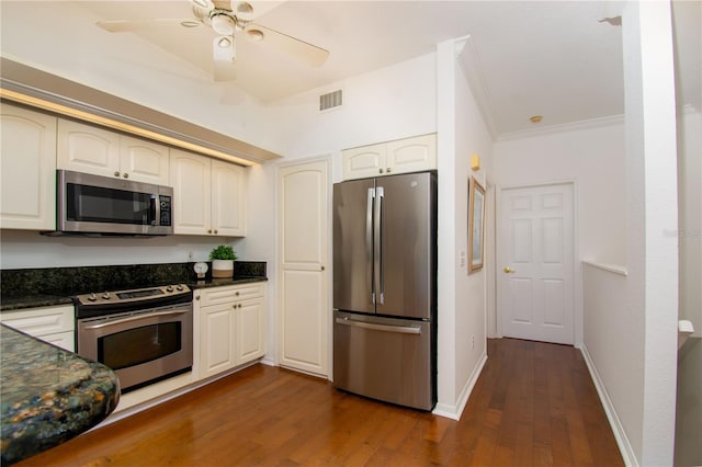 kitchen featuring stainless steel appliances, crown molding, ceiling fan, and dark wood-type flooring