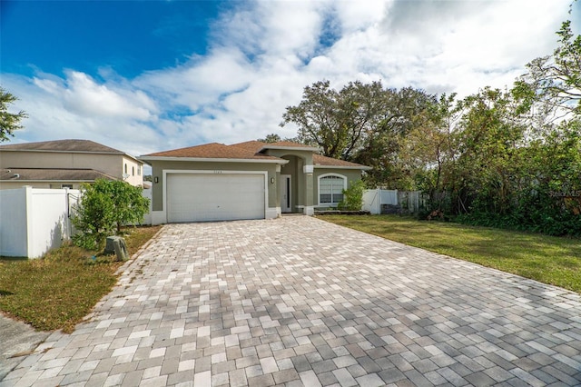 view of front facade featuring a garage and a front yard