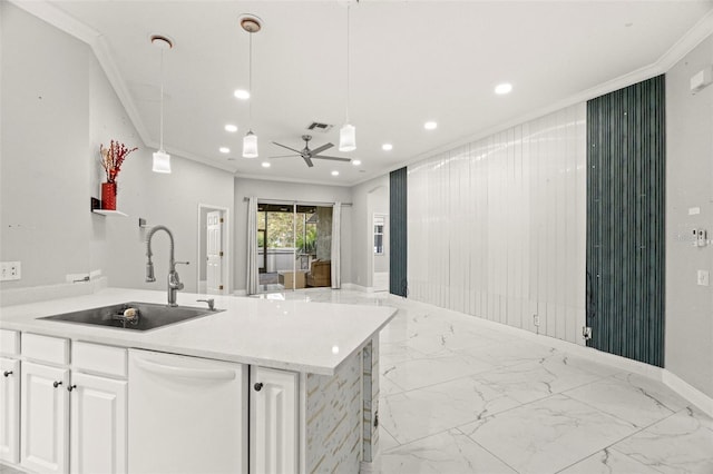 kitchen featuring white cabinets, sink, pendant lighting, and dishwasher