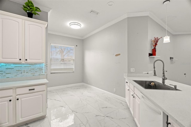 kitchen featuring white cabinets, ornamental molding, hanging light fixtures, and sink