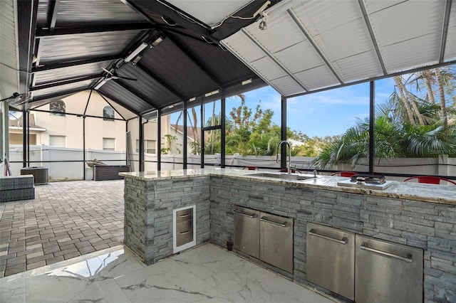 view of patio / terrace featuring exterior kitchen and sink