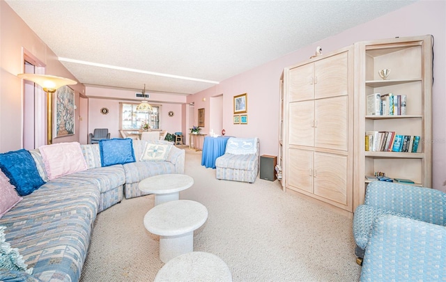 carpeted living room with a textured ceiling