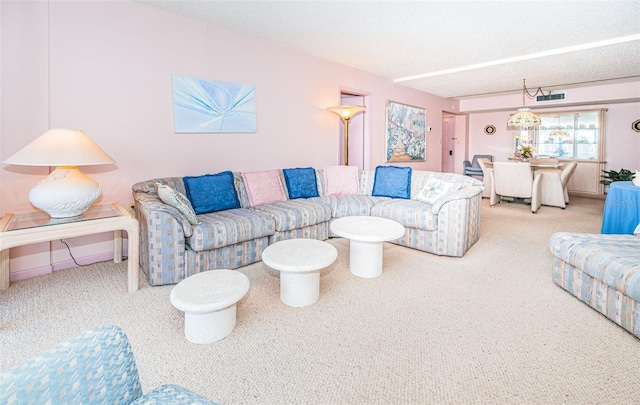 carpeted living room featuring a textured ceiling