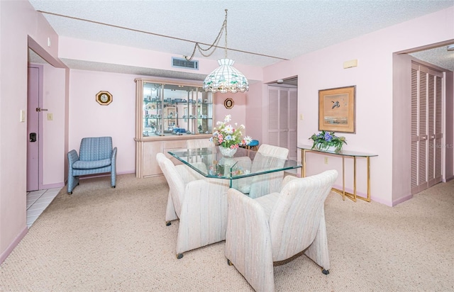 dining room with a textured ceiling