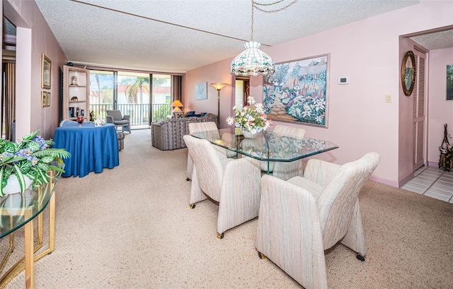 dining area featuring a textured ceiling