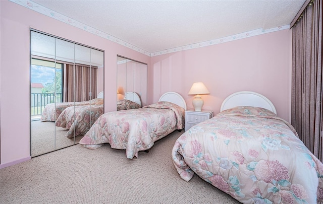 carpeted bedroom with a textured ceiling