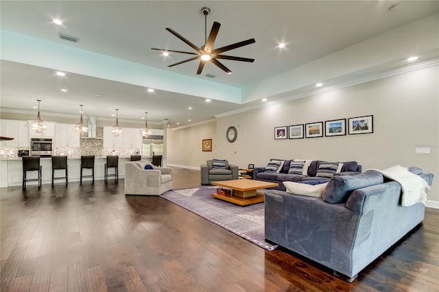 living room with ceiling fan and dark hardwood / wood-style flooring