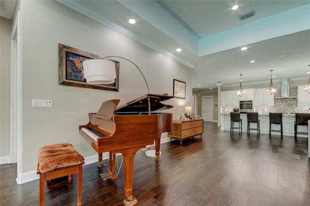 misc room with ornamental molding and dark wood-type flooring