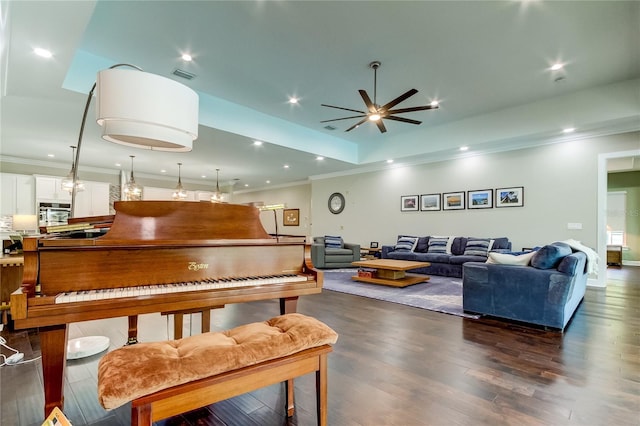 interior space featuring ceiling fan, dark wood-type flooring, and ornamental molding