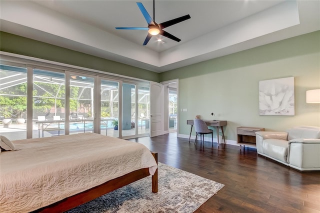 bedroom with access to exterior, ceiling fan, and dark wood-type flooring