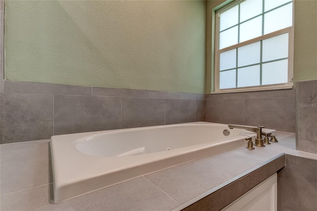 bathroom with a tub to relax in