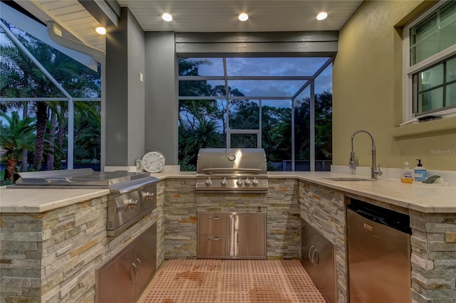 view of patio featuring an outdoor kitchen, a grill, a lanai, and sink