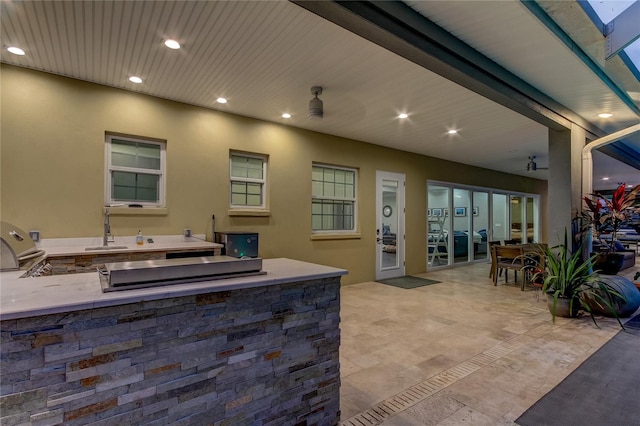 view of patio with sink and exterior kitchen