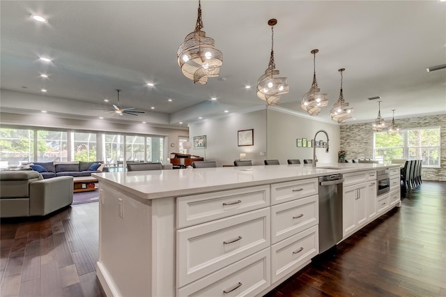 kitchen with ceiling fan, dishwasher, white cabinets, hanging light fixtures, and a large island