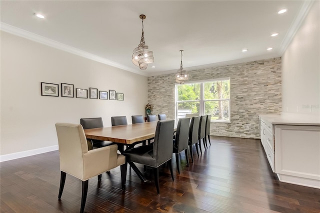 dining room with dark hardwood / wood-style flooring and ornamental molding