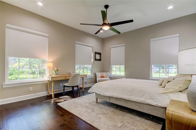 bedroom featuring dark hardwood / wood-style flooring and ceiling fan