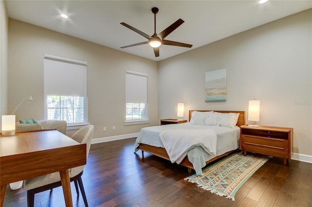 bedroom with ceiling fan and dark hardwood / wood-style flooring