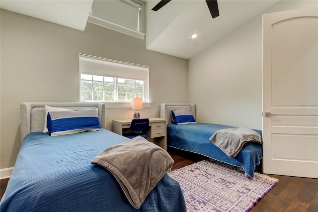 bedroom with lofted ceiling, ceiling fan, and dark hardwood / wood-style floors