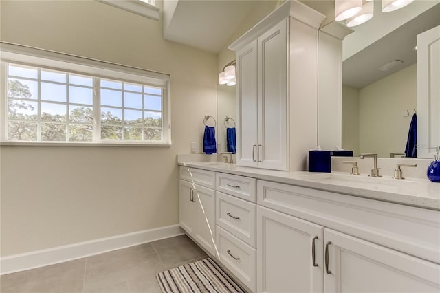 bathroom with tile patterned flooring and vanity