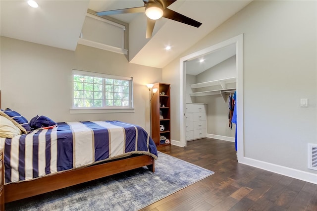 bedroom with dark hardwood / wood-style flooring, a closet, vaulted ceiling, and ceiling fan