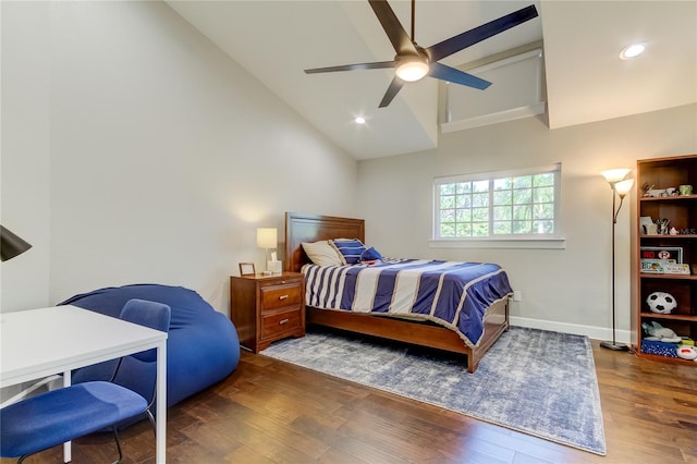 bedroom with ceiling fan, dark hardwood / wood-style flooring, and high vaulted ceiling