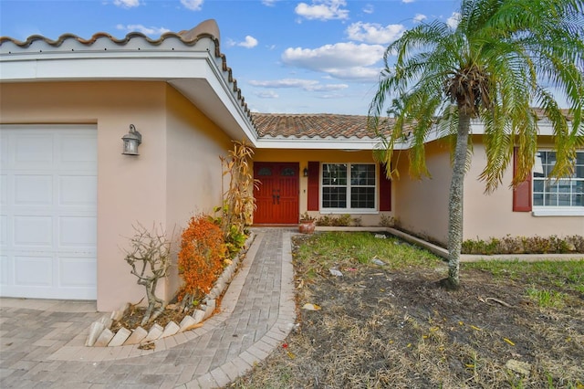 entrance to property featuring a garage