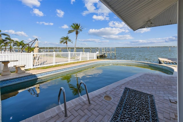 view of pool featuring a water view and a patio area