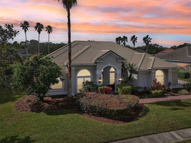 view of front of home with a lawn