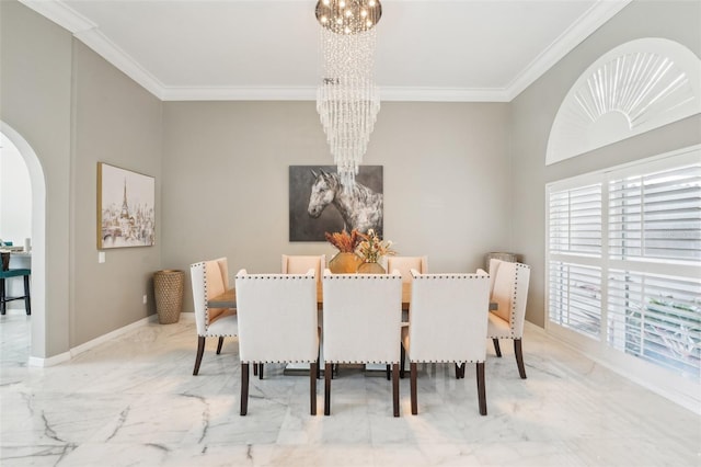 dining space featuring a chandelier and crown molding