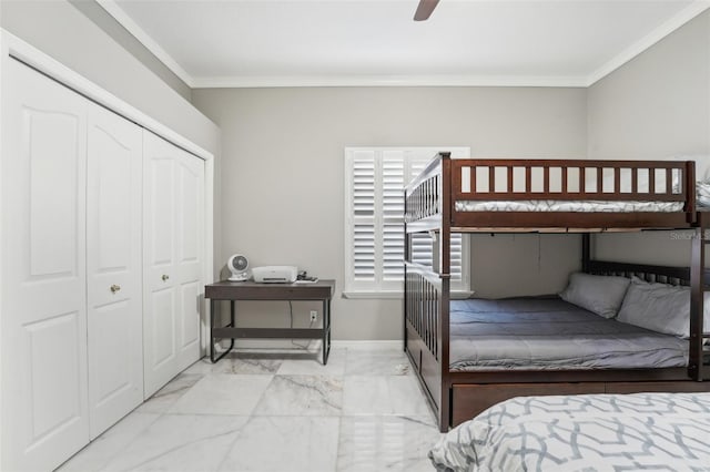 bedroom with ceiling fan, crown molding, and a closet