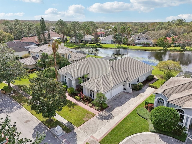 birds eye view of property with a water view