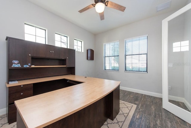 home office with dark hardwood / wood-style flooring, a wealth of natural light, and ceiling fan